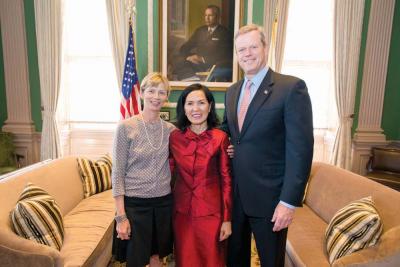 Mary Truong (center) stands with Marylou Sudders, Sec. of Mass. Executive Office of Health and Human Services, and Gov. Charlie Baker at her swearing-in as head of Mass. Office for Refugees and Immigrants.